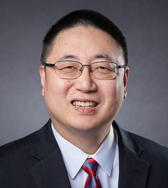 Smiling man in suit and tie