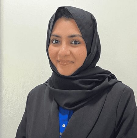 Confident woman in black headscarf, smiling