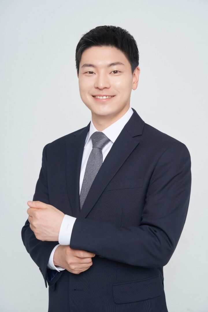 Smiling man in a dark suit