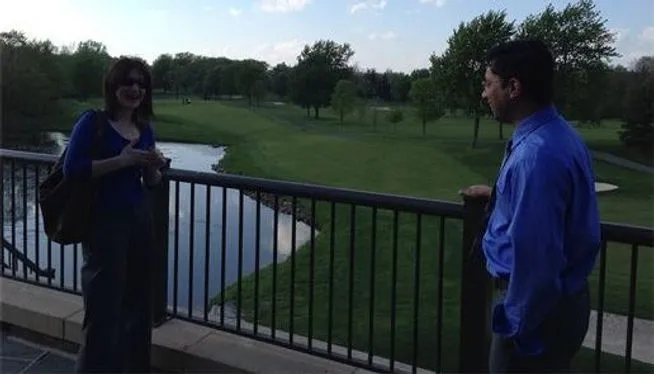 Conversation overlooking a lush landscape