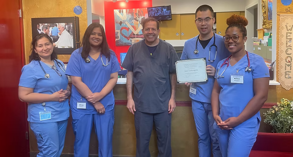 Medical team with certificate in clinic