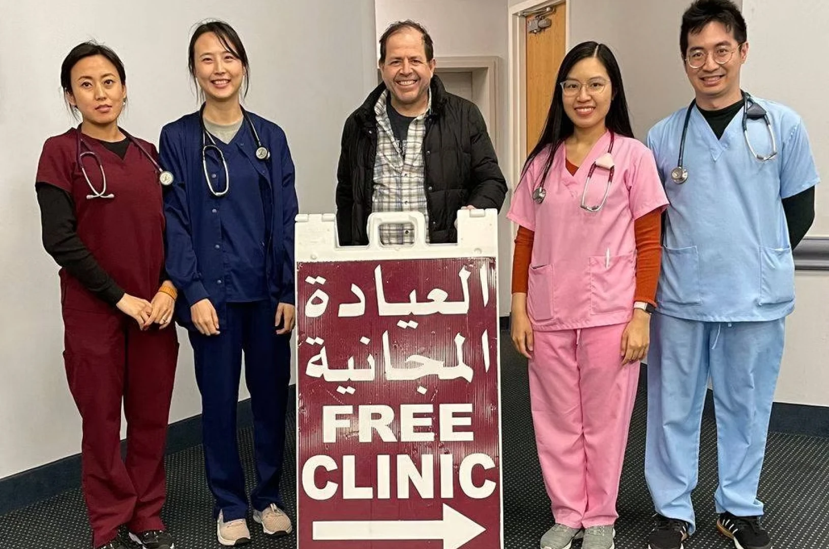 Medical staff at free clinic entrance