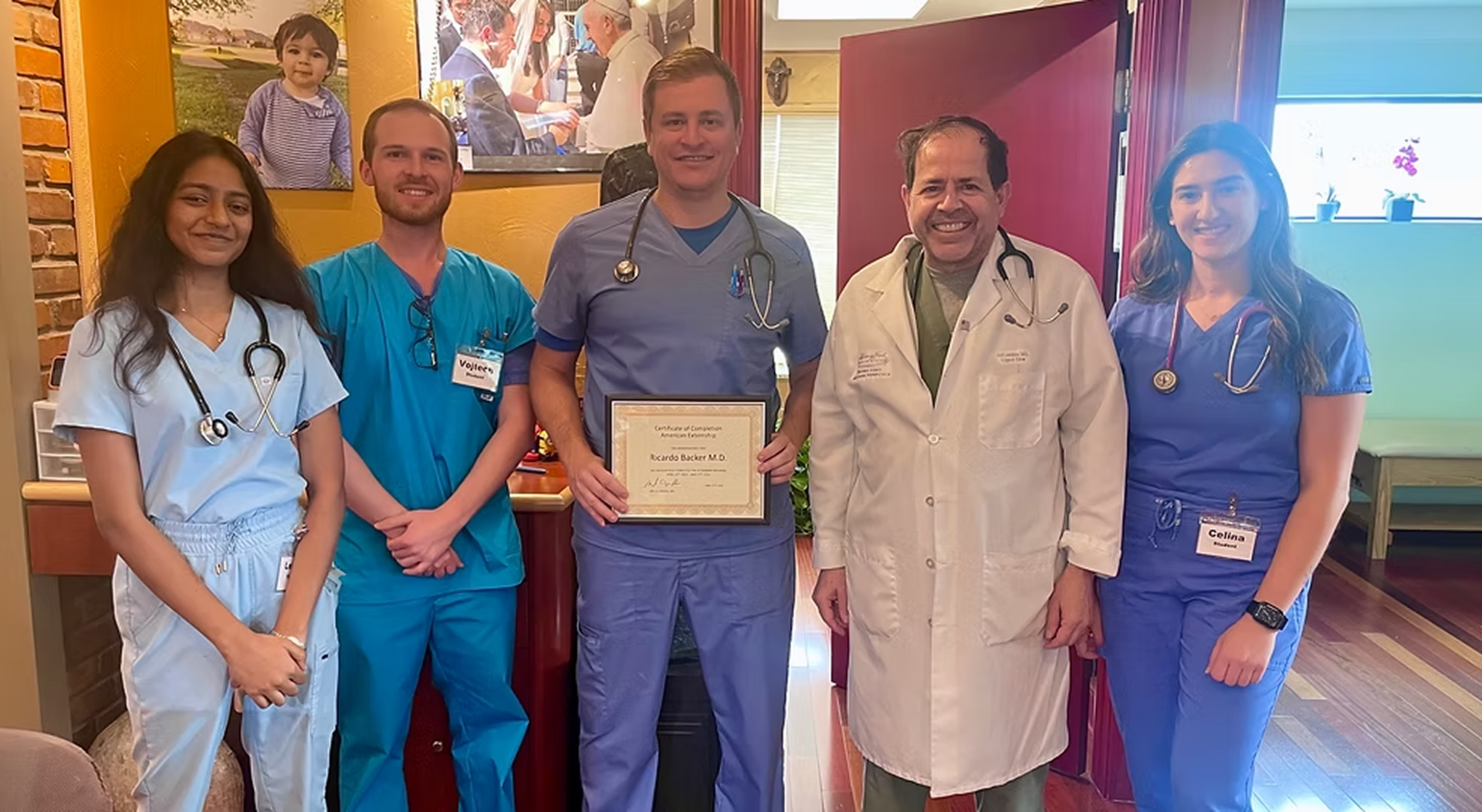 Medical team with award certificate