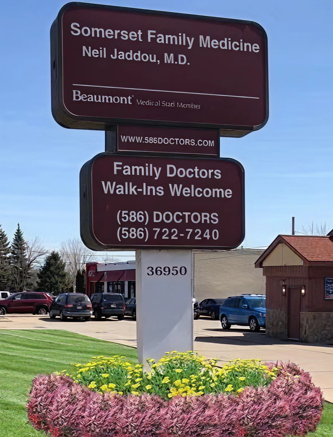 Medical clinic sign and parking lot