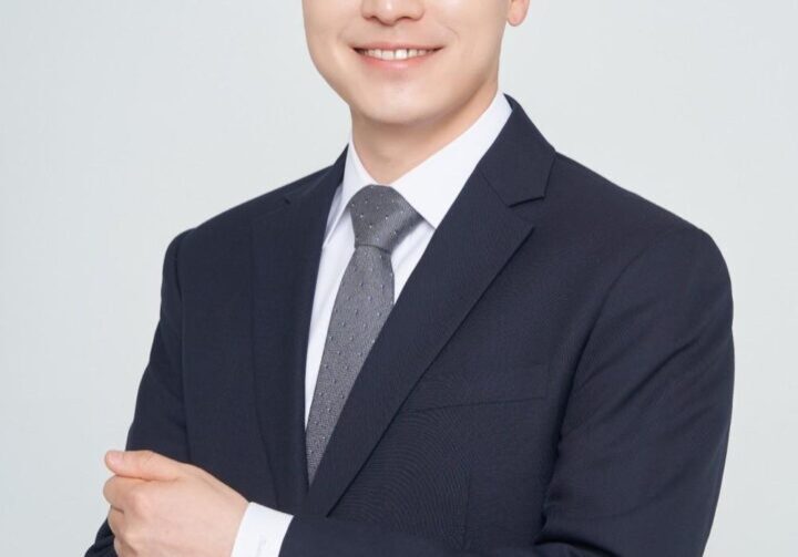 Smiling man in a dark suit