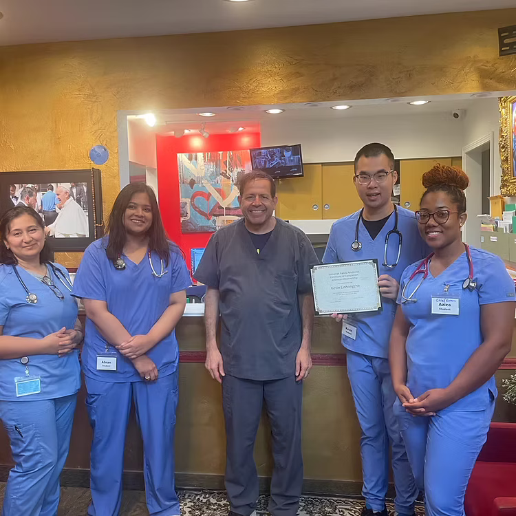Medical team posing with certificate